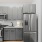 Kitchen with gray cabinetry and stainless steel appliances