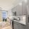 Gray cabinets in studio apartment kitchen