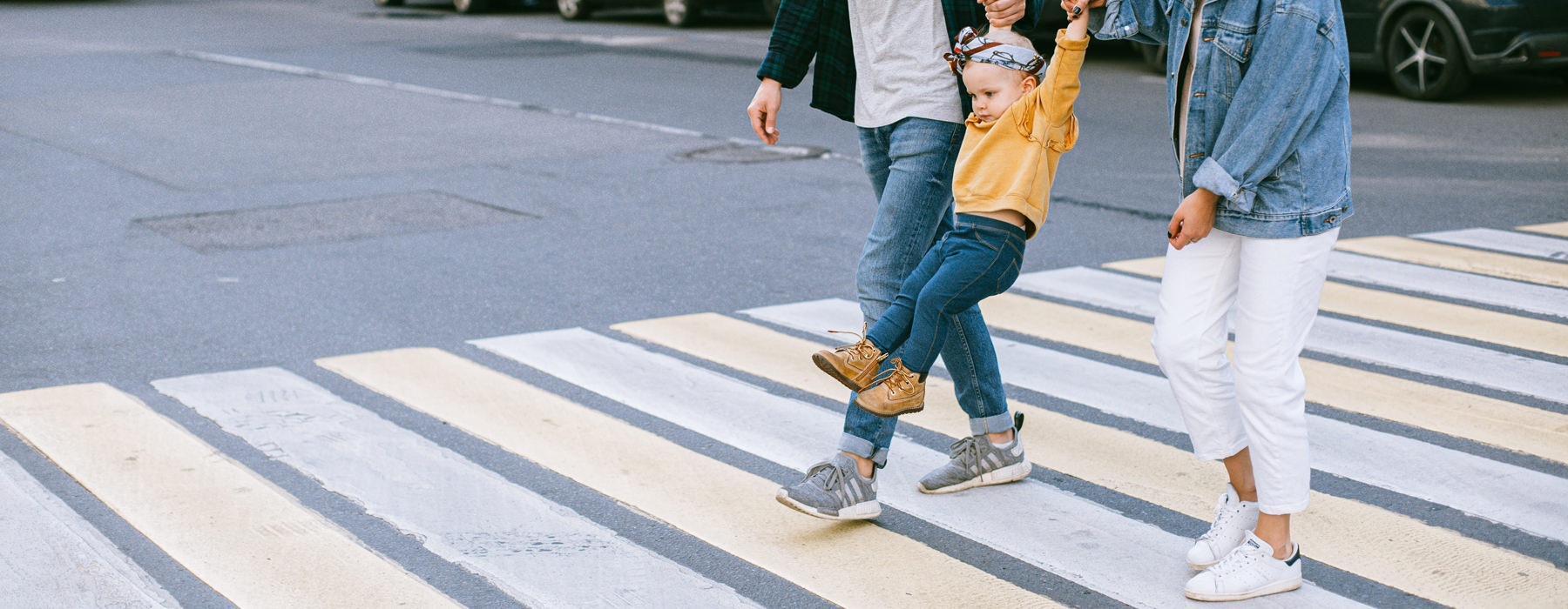 A family walking across the street